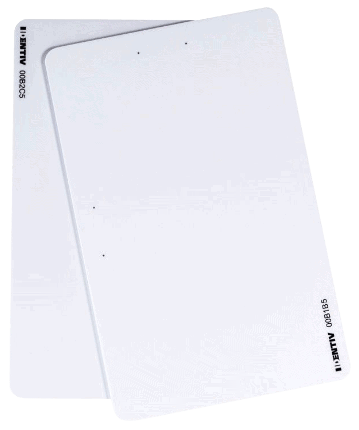 Two overlapping white rectangular plastic cards with black printed numbers and text in the corners, viewed against a plain white background.
